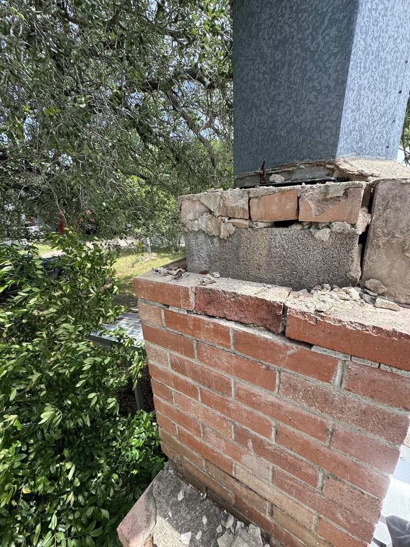 Broken chimney masonry before repair