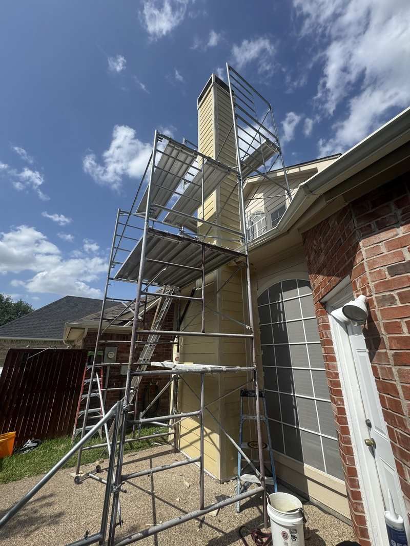 House with scaffolding before chimney work
